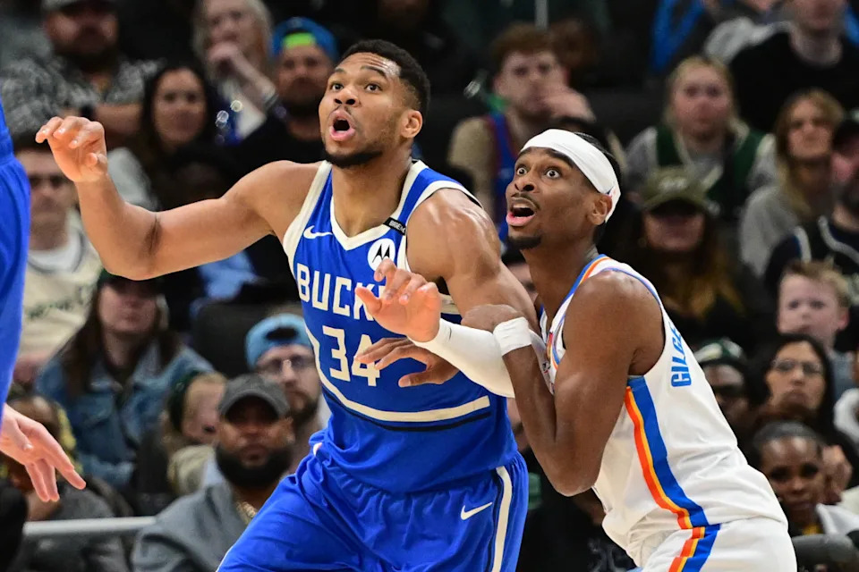 Milwaukee Bucks forward Giannis Antetokounmpo and Oklahoma City Thunder guard Shai Gilgeous-Alexander jostle for position under the basket in the second quarter at Fiserv Forum.Benny Sieu-Imagn Images