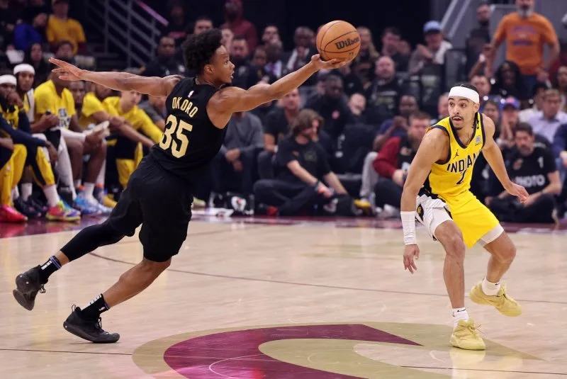 Cleveland Cavaliers forward Isaac Okoro (35) attempts a steal against the Indiana Pacers in Game 5 of the Eastern Conference semifinals Tuesday in Cleveland. Photo by Aaron Josefczyk/UPI