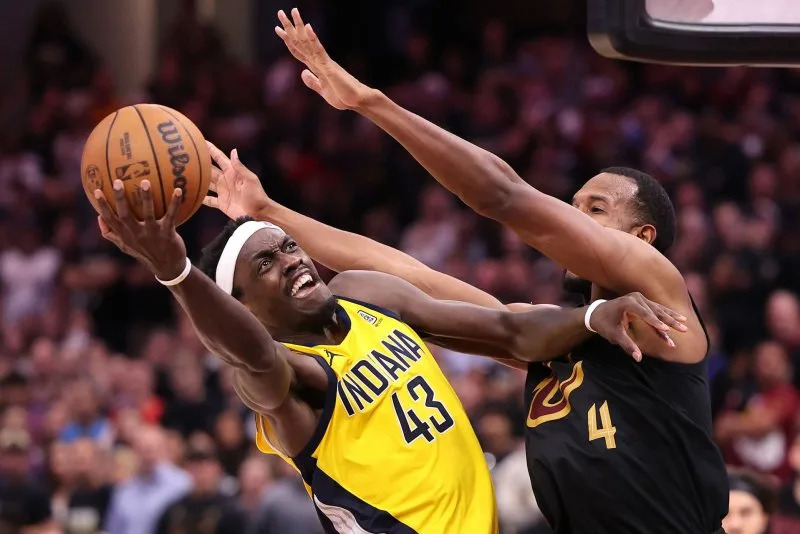 Indiana Pacers forward Pascal Siakam (L) puts up a shot around the defense of Cleveland Cavaliers forward Evan Mobley in Game 5 of the Eastern Conference semifinals Tuesday in Cleveland. Photo by Aaron Josefczyk/UPI