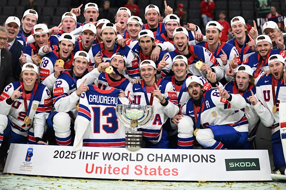Team USA holds up Johnny Gaudreau's jersey while celebrating their championship. (Jonathan Nackstrand/AFP via Getty Images)