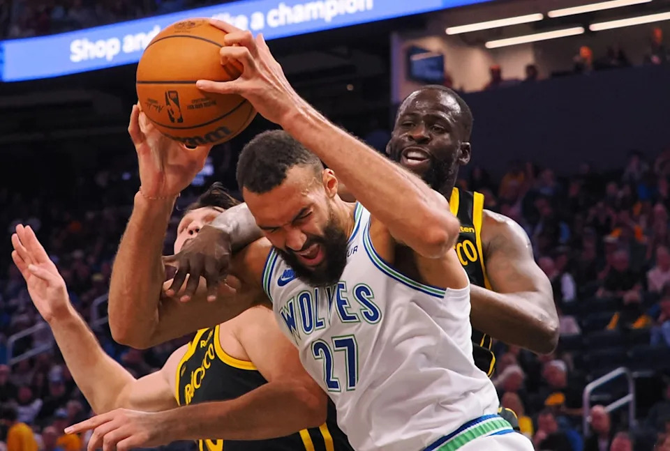 Golden State Warriors forward Draymond Green (23) fouls Minnesota Timberwolves center Rudy Gobert (27) Mandatory Credit&colon; Kelley L Cox-Imagn Images
