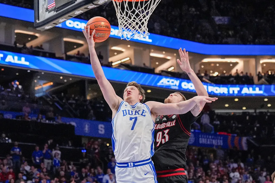 Mar 15, 2025; Charlotte, NC, USA; Duke Blue Devils guard Kon Knueppel (7) goes to the basket chased by Louisville Cardinals forward Noah Waterman (93) during the 2025 ACC Conference Championship game at Spectrum Center. Mandatory Credit: Jim Dedmon-Imagn Images