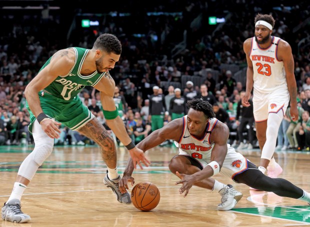 Boston's Jayson Tatum, left, and OG Anunoby of the New York Knicks go after a loose ball during the second half of Game 2 of the Eastern Conference semifinals at the Garden. (Photo By Matt Stone/Boston Herald)