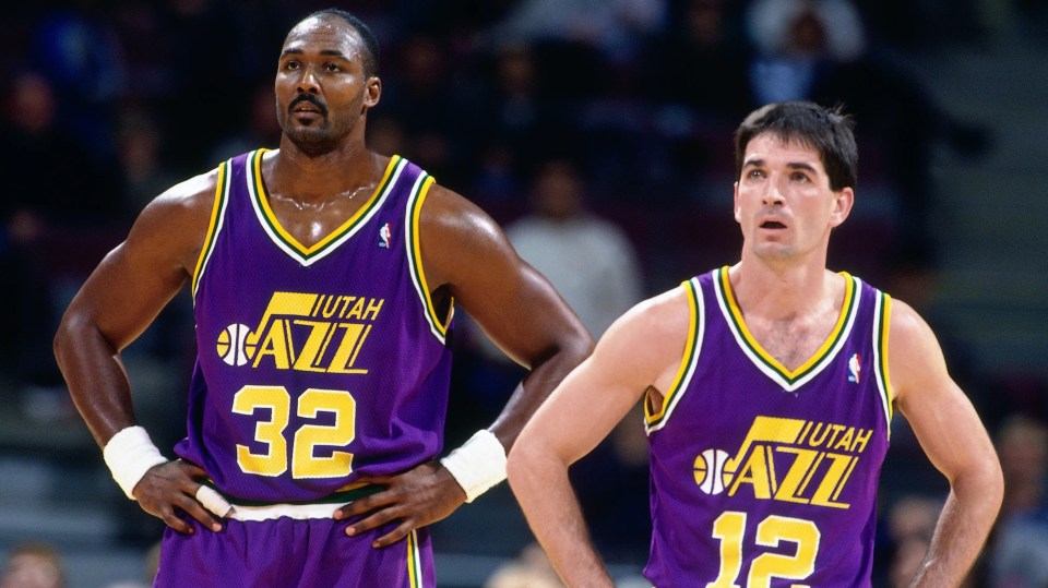 AUBURN HILLS, MI - NOVEMBER 17: Karl Malone #32 and John Stockton #12 of the Utah Jazz look on during a game played on November 17, 1995 at the Palace of Auburn Hills in Auburn Hills, Michigan. NOTE TO USER: User expressly acknowledges and agrees that, by downloading and/or using this photograph, user is consenting to the terms and conditions of the Getty Images License Agreement. Mandatory Copyright Notice: Copyright 1995 NBAE (Photo by Nathaniel S. Butler/NBAE via Getty Images)