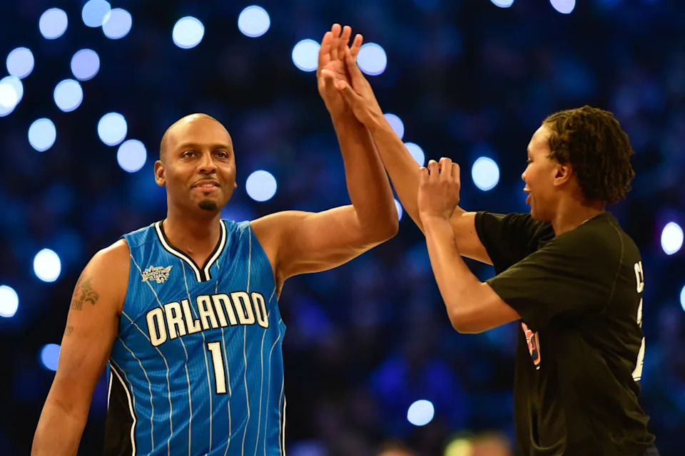Team Westbrook legend Penny Hardaway and Team Westbrook forward Tamika Catchings of the Indiana Fever high-five during the 2015 NBA All-Star Shooting Stars competition at Barclays Center.Bob Donnan-Imagn Images