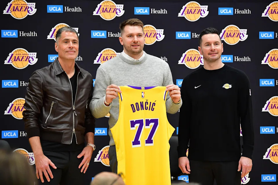 Los Angeles Lakers guard Luka Doncic (77) with general manager Rob Pelinka and head coach JJ Redick.Gary A. Vasquez-Imagn Images