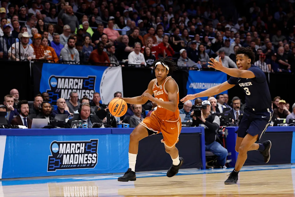 Mar 19, 2025; Dayton, OH, USA; Texas Longhorns guard Tre Johnson (20) dribbles pressured by Xavier Musketeers guard Dailyn Swain (3) in the first half at UD Arena. Mandatory Credit: Rick Osentoski-Imagn Images