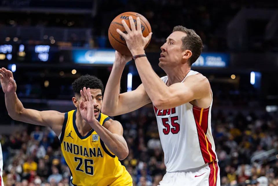 Nov 15, 2024; Indianapolis, Indiana, USA; Miami Heat forward Duncan Robinson (55) shoots the ball while Indiana Pacers guard Ben Sheppard (26) defends in the second half at Gainbridge Fieldhouse© Trevor Ruszkowski-Imagn Images