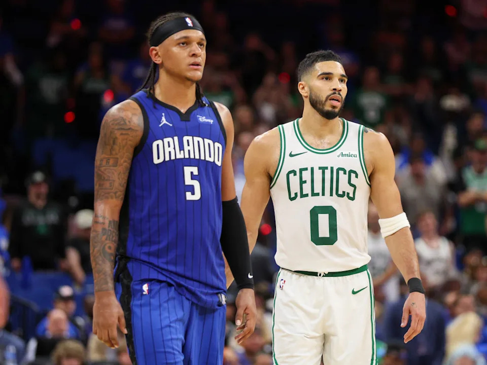 Paolo Banchero at the Kia Center in Orlando next to Celtics star Jayson Tatum. © Nathan Ray Seebeck-Imagn Images