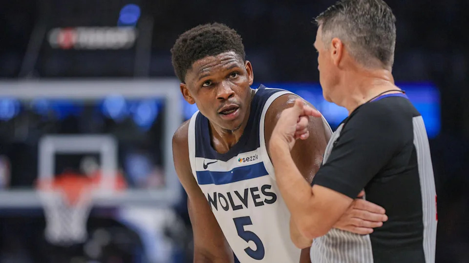 Minnesota Timberwolves guard Anthony Edwards (5) chats with referee Pat Fraher (26) during the first half of Game 2 of an NBA basketball Western Conference Finals playoff series against the Oklahoma City Thunder Thursday, May 22, 2025, in Oklahoma City. (AP Photo/Nate Billings)