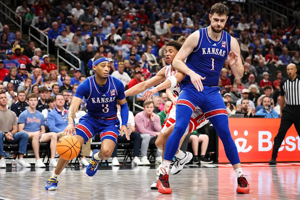 Kansas basketball guard Dajuan Harris Jr. (3) drives to the basket during a March 13, 2025 game against Arizona at T-Mobile Center in Kansas City, Missouri.