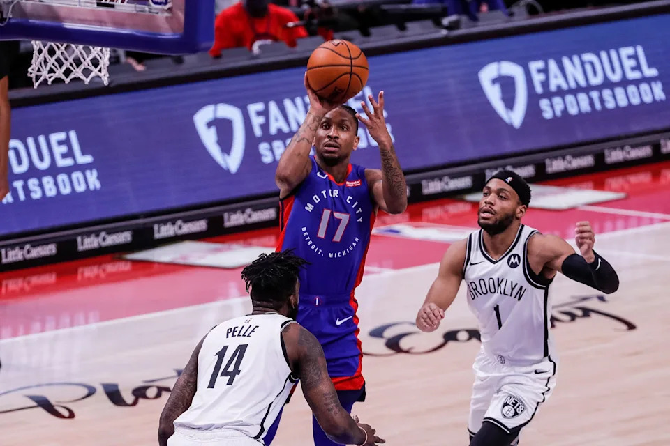 Detroit Pistons guard Rodney McGruder makes a jump shot against Brooklyn Nets center Norvel Pelle and guard Bruce Brown during the first half at Little Caesars Arena, Tuesday, Feb. 9, 2021.
