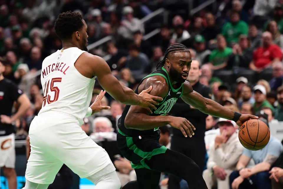 Nov 19, 2024; Boston, Massachusetts, USA; Boston Celtics guard Jaylen Brown (7) controls the ball while Cleveland Cavaliers guard Donovan Mitchell (45) defends during the first half at TD Garden. Mandatory Credit: Bob DeChiara-Imagn Images
