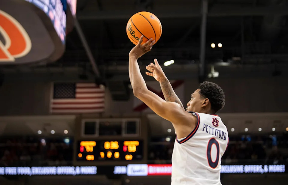 Auburn Tigers guard Tahaad Pettiford (0) takes a jump shot as Auburn Tigers take on Oklahoma Sooners at Neville Arena in Auburn, Ala., on Tuesday, Feb. 4, 2025. Auburn Tigers defeated Oklahoma Sooners 98-70.