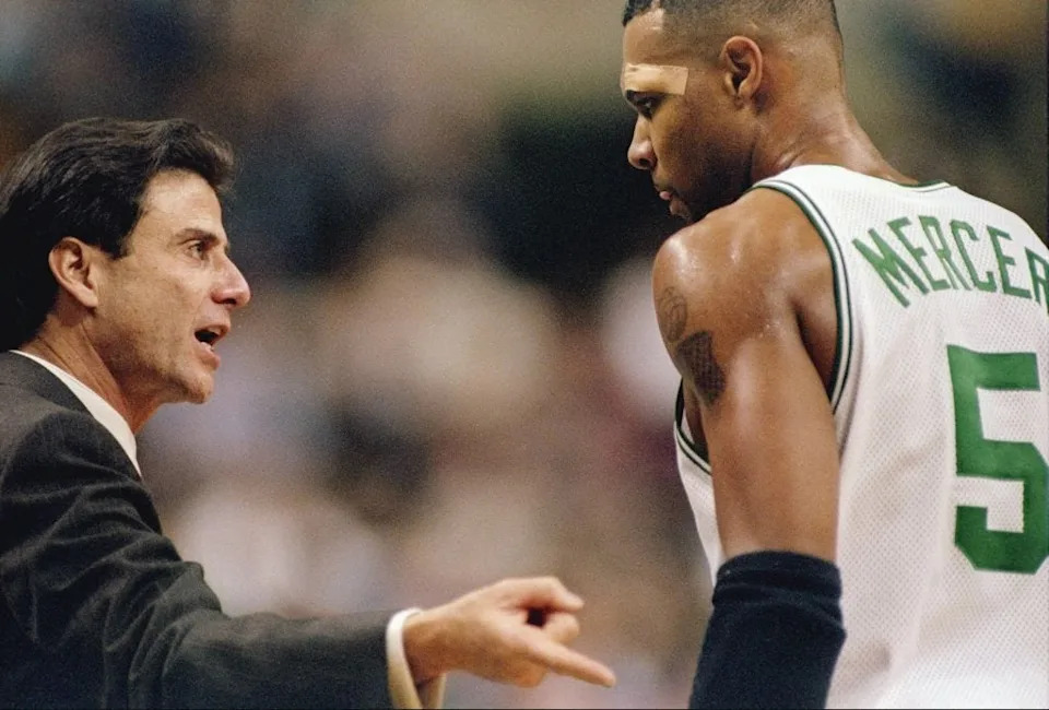 21 Nov 1997: Head coach Rick Pitino of the Boston Celtics (left) talks to his guard Ron Mercer during a game against the New Jersey Nets at the Fleet Center in Boston, Massachusetts. The Celtics won the game 101-93. Mandatory Credit: Jamie Squire /Allsport