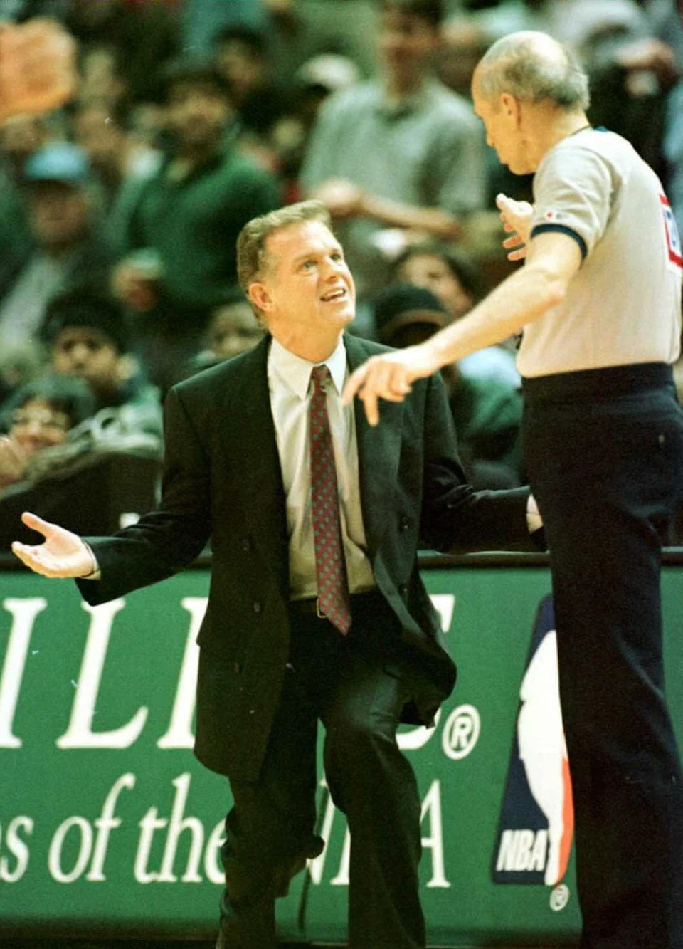 LANDOVER, MD - FEBRUARY 19: Washington Bullets coach Jim Lynam pleads with referee Dick Bavetta to score the shot at the buzzer by Rasheed Wallace at the end of the first quarter in Landover.