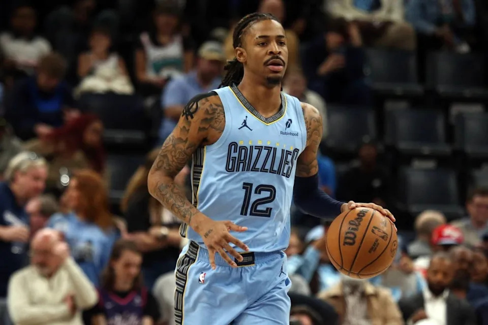 Memphis Grizzlies guard Ja Morant (12) dribbles up the court during the first quarter against the Phoenix Suns at FedExForum.Mandatory Credit: Petre Thomas-Imagn Images