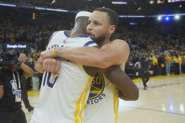 Golden State Warriors forward Jimmy Butler III, left, celebrates with guard Stephen Curry after an NBA play-in tournament basketball game against the Memphis Grizzlies in San Francisco, Tuesday, April 15, 2025. (AP Photo/Jeff Chiu) Jimmy Butler determined to bring Stephen Curry, Draymond Green another championship