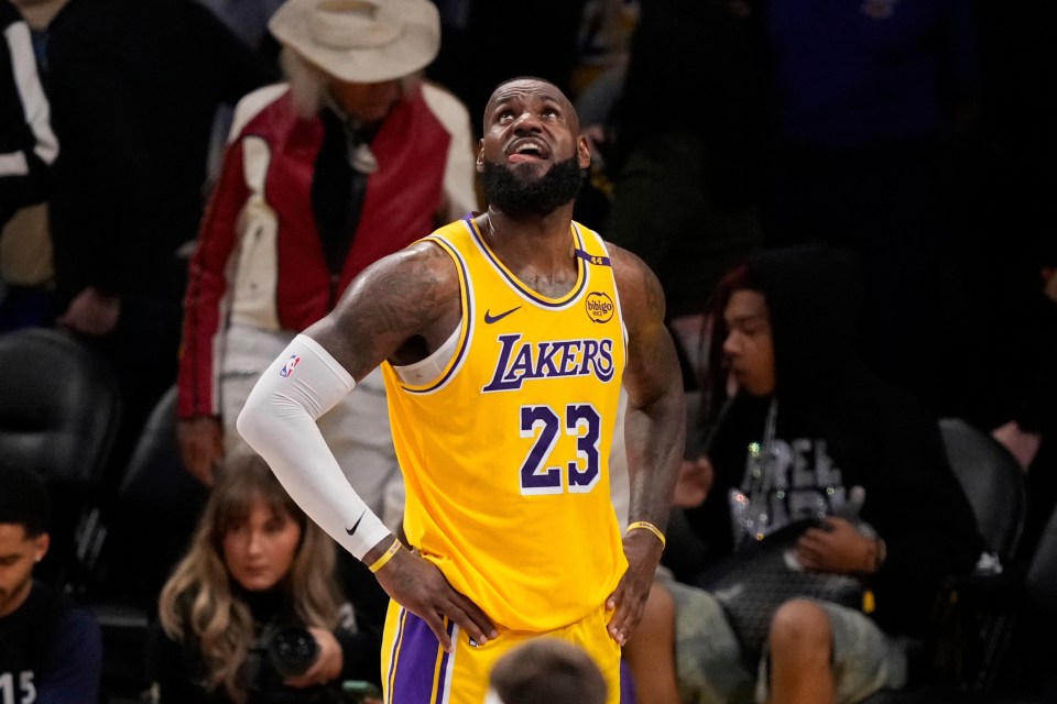 LeBron James looking up at the scoreboard during a Lakers game.