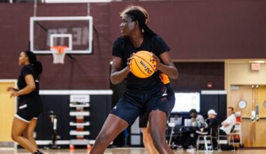 Atlanta Dream guard Te-Hina Paopao (2) drives on Indiana Fever guard Caitlin Clark (22) in the first half at State Farm Arena. Mandatory Credit: Brett Davis-Imagn Images