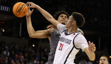 Miles Byrd #21 of the San Diego State Aztecs fouls Yaxel Lendeborg #3 of the UAB Blazers during the...