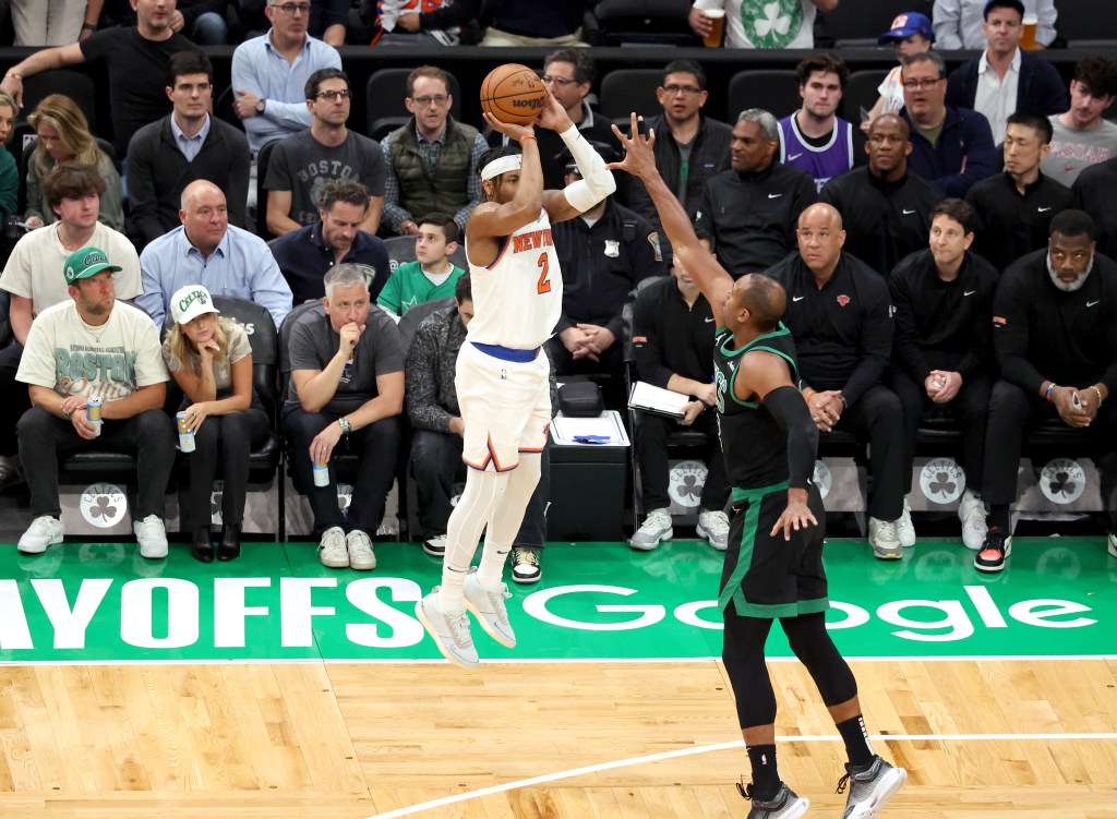 Miles McBride #2 of the New York Knicks puts up a three-point shot over Al Horford #42 of the Boston Celtics during the second quarter.
