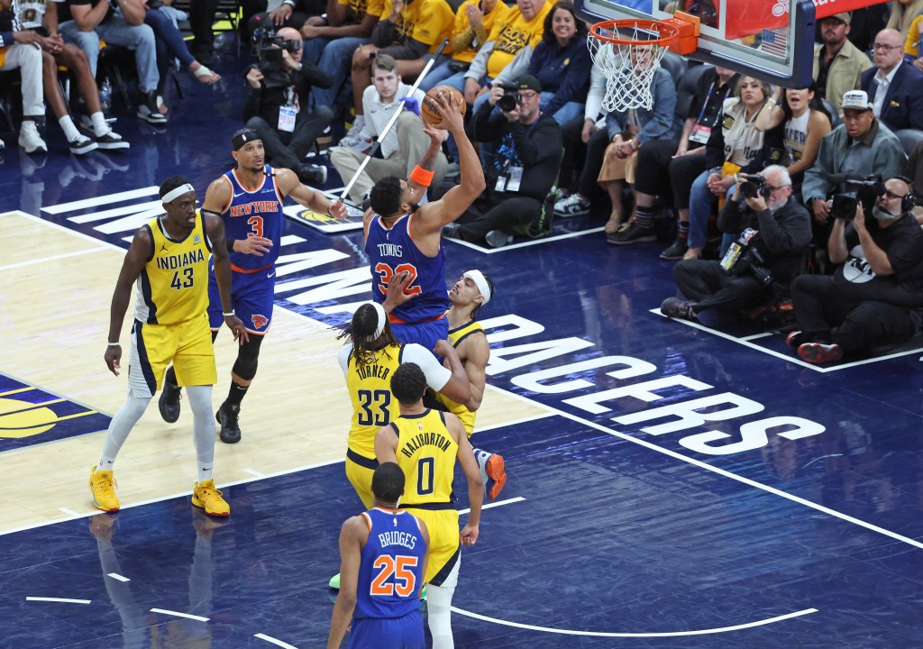 Karl-Anthony Towns drives to the basket during the fourth quarter of the Knicks' Game 3 win May 26.