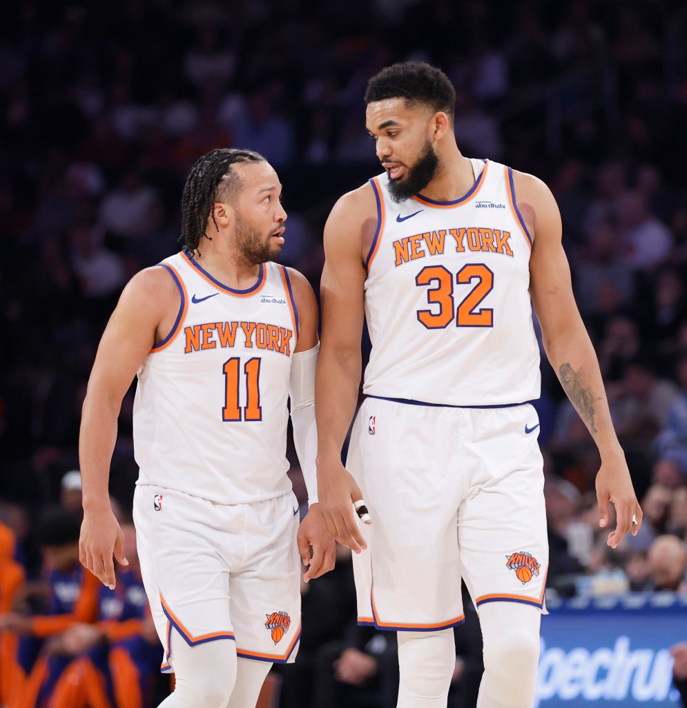 New York Knicks players Karl-Anthony Towns and Jalen Brunson discussing on the court during a game at Madison Square Garden