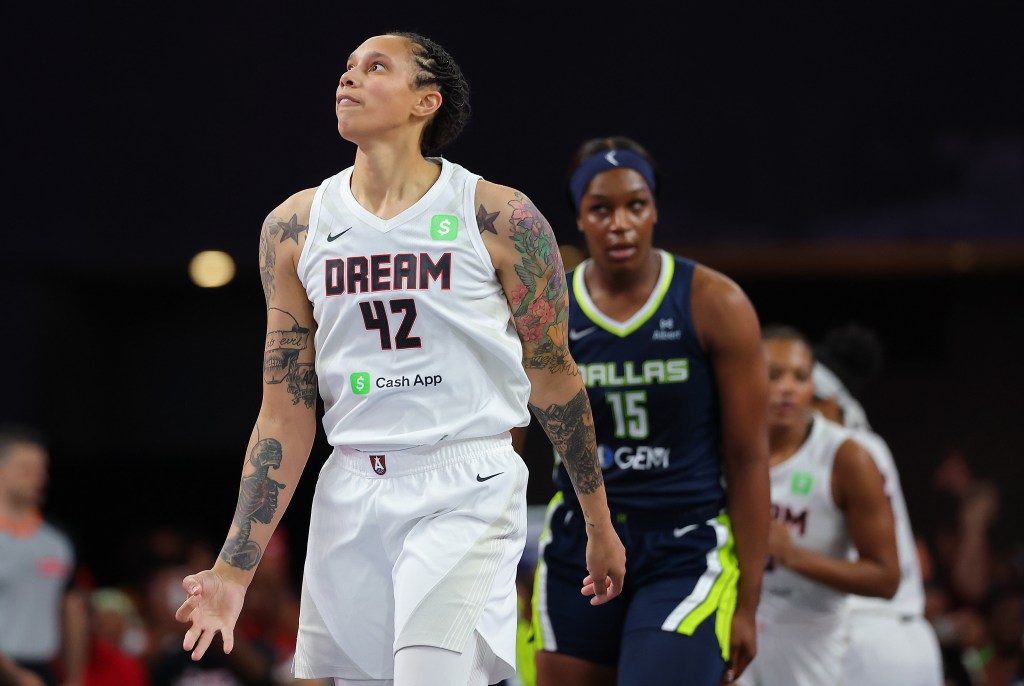Brittney Griner of the Atlanta Dream celebrating after scoring a three-point basket against the Dallas Wings during a basketball game