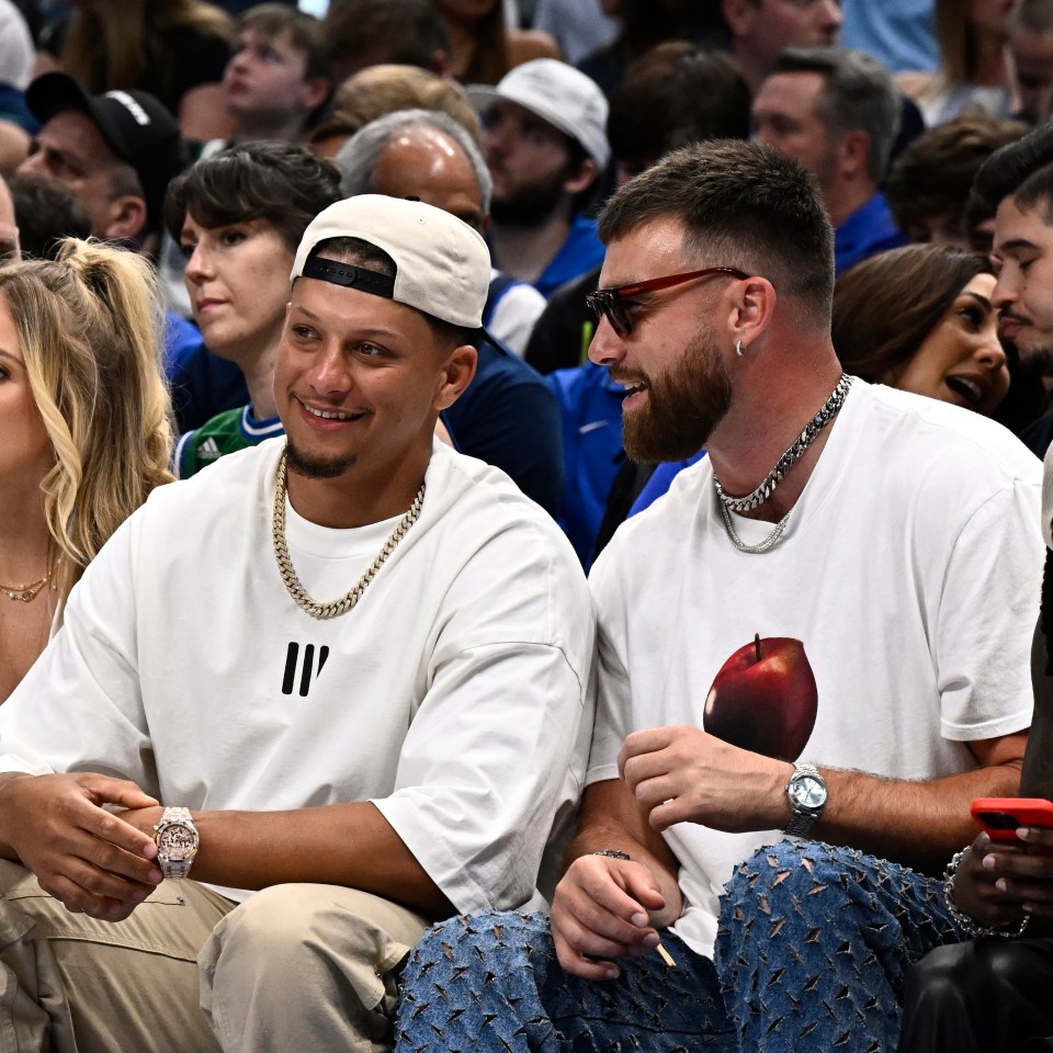 Patrick Mahomes and Travis Kelce sitting courtside at an NBA game.