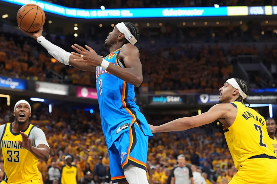 Oklahoma City Thunder guard Shai Gilgeous-Alexander shoots as Indiana Pacers guard Andrew Nembhard, right, defends during the second half of Game 4 of the NBA Finals basketball series, Friday, June 13, 2025, in Indianapolis. (AP Photo/Michael Conroy)