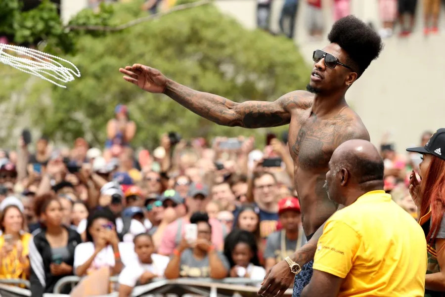 Iman Shumpert #4 of the Cleveland Cavaliers throws beads to the crowd during the Cleveland Cavaliers 2016 NBA Championship victory parade and rally on June 22, 2016 in Cleveland, Ohio. (Photo by Mike Lawrie/Getty Images)