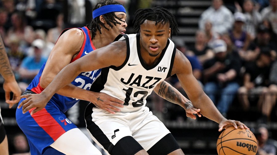 Utah Jazz guard Isaiah Collier (13) spins away from Philadelphia 76er R.J. Hampton (26) as the Utah...