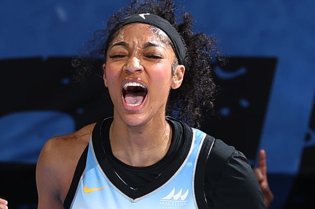 Angel Reese celebrates during a game