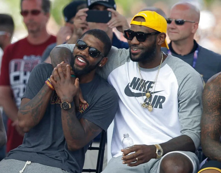 Cleveland Cavaliers’ LeBron James, right, and Kyrie Irving hug during a rally Wednesday, June 22, 2016, in Cleveland. The Cavaliers made history by overcoming a 3-1 deficit to beat the Golden State Warriors in the NBA Finals and end the city’s 52-year drought without a professional sports championship. (AP Photo/Tony Dejak)