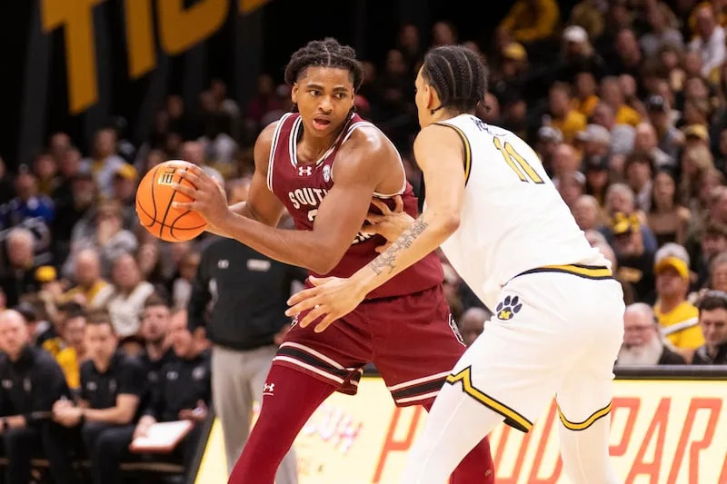 South Carolina's Collin Murray-Boyles, left, looks to pass around Missouri's Trent Pierce (11) during the first half of an NCAA college basketball game Tuesday, Feb. 25, 2025, in Columbia, Mo. | L.G. Patterson