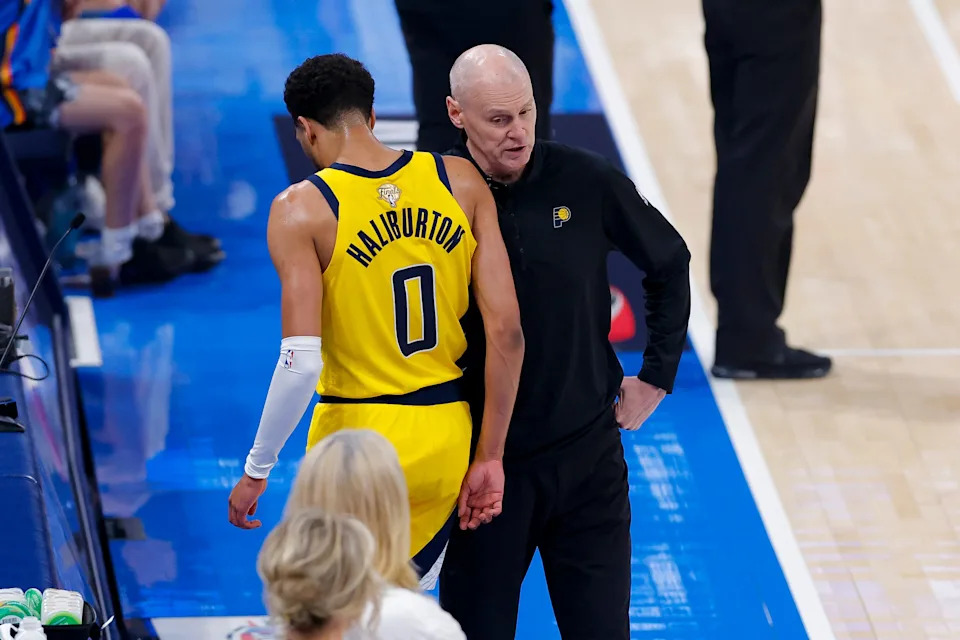Indiana Pacers guard Tyrese Haliburton comes off the floor past head coach Rick Carlisle in the first quarter against the Oklahoma City Thunder during Game 5 of the 2025 NBA Finals at Paycom Center in Oklahoma City on June 16, 2025.