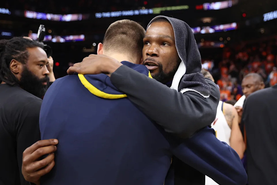 PHOENIX, ARIZONA - MAY 11: Kevin Durant #35 of the Phoenix Suns talks to Nikola Jokic #15 of the Denver Nuggets after the Nuggets defeated the Suns 125-100 in game six of the Western Conference Semifinal Playoffs at Footprint Center on May 11, 2023 in Phoenix, Arizona. NOTE TO USER: User expressly acknowledges and agrees that, by downloading and or using this photograph, User is consenting to the terms and conditions of the Getty Images License Agreement. (Photo by Christian Petersen/Getty Images)