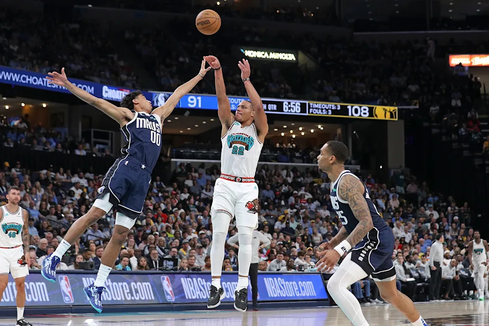 MEMPHIS, TENNESSEE - APRIL 18: Desmond Bane #22 of the Memphis Grizzlies takes a shot against Max Christie #00 of the Dallas Mavericks during the second half of the Play-In Tournament at FedExForum on April 18, 2025 in Memphis, Tennessee. NOTE TO USER: User expressly acknowledges and agrees that, by downloading and or using this photograph, User is consenting to the terms and conditions of the Getty Images License Agreement. (Photo by Justin Ford/Getty Images)