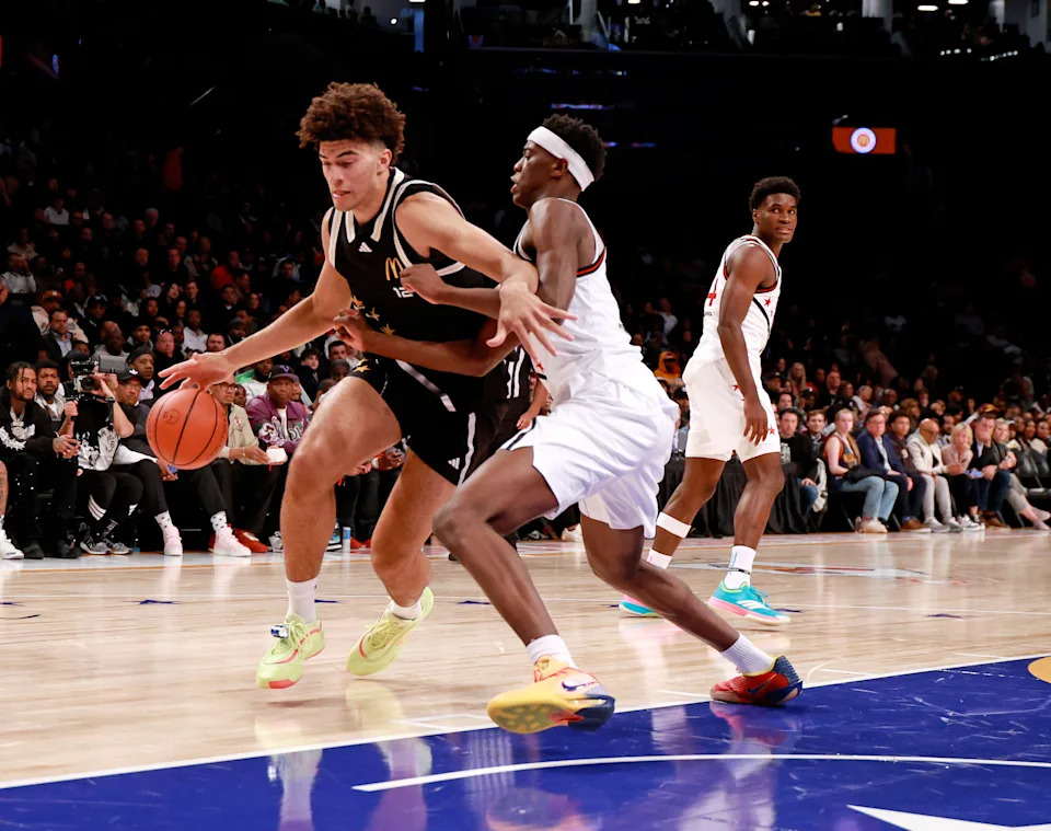 BROOKLYN, NY - APRIL 01: McDonalds High School All American Cameron Boozer (12) drives to the basket against AJ Dybantsa during the McDonalds Boys High School All American Game on April 1, 2025, at the Barclays Center in Brooklyn, New York. (Photo by Brian Spurlock/Icon Sportswire via Getty Images)
