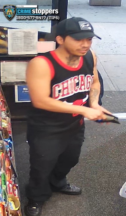 The suspect is shown wearing a Chicago Bulls jersey, with tattoos on his neck and arm.