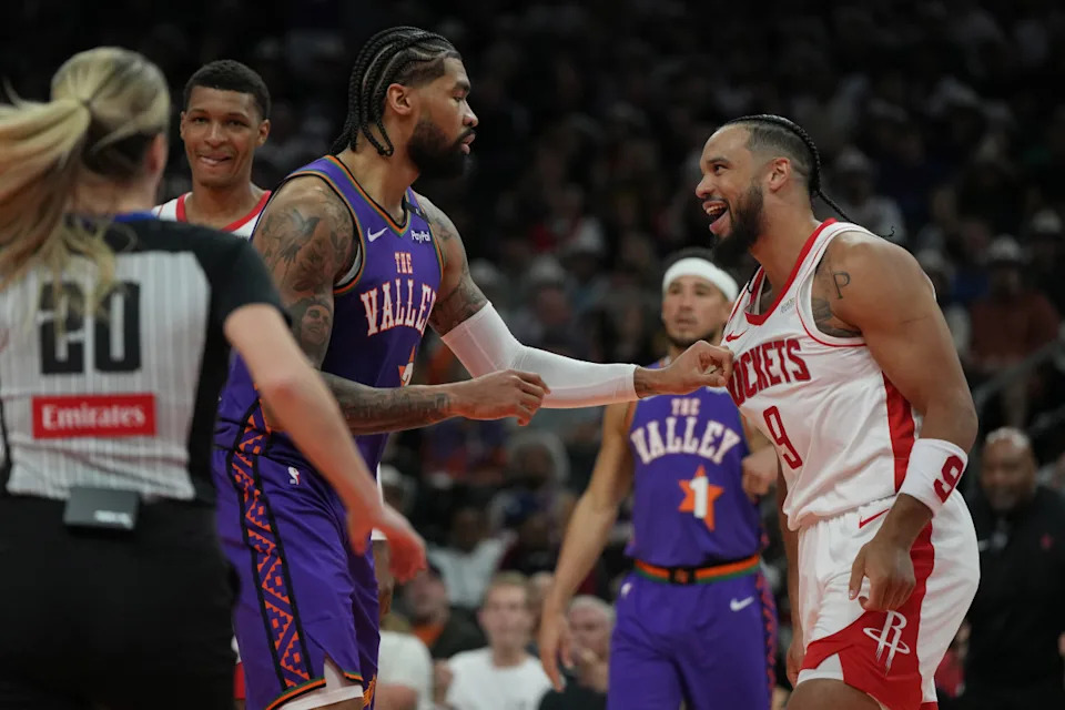 Phoenix Suns center Nick Richards (2) and Houston Rockets forward Dillon Brooks (9)© Rick Scuteri-Imagn Images