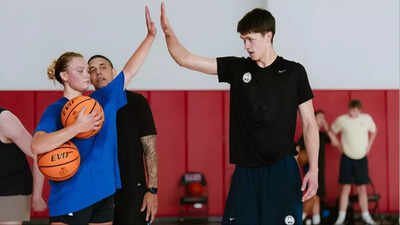 Egor Demin celebrates with girlfriend Delaney Gibb after Brooklyn Nets' pick