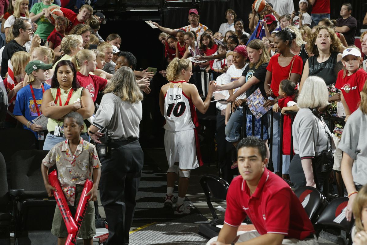 Stiles signs autographs