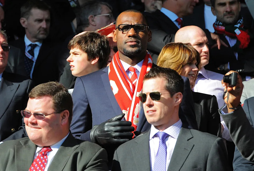 US basketball player Lebron James (C), a minority owner at Anfield, looks on before the English Premier League football match between Liverpool and Manchester United at Anfield in Liverpool, north-west England on October 15, 2011. AFP PHOTO/ANDREW YATES
RESTRICTED TO EDITORIAL USE. No use with unauthorized audio, video, data, fixture lists, club/league logos or “live†services. Online in-match use limited to 45 images, no video emulation. No use in betting, games or single club/league/player publications. (Photo credit should read ANDREW YATES/AFP via Getty Images)