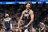 Dallas Mavericks center Dereck Lively II (2) and guard Jaden Hardy (1) celebrate after...