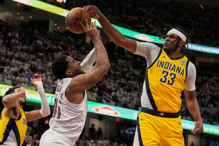 Indiana Pacers' Myles Turner (33) blocks a shot by Cleveland Cavaliers guard Donovan...