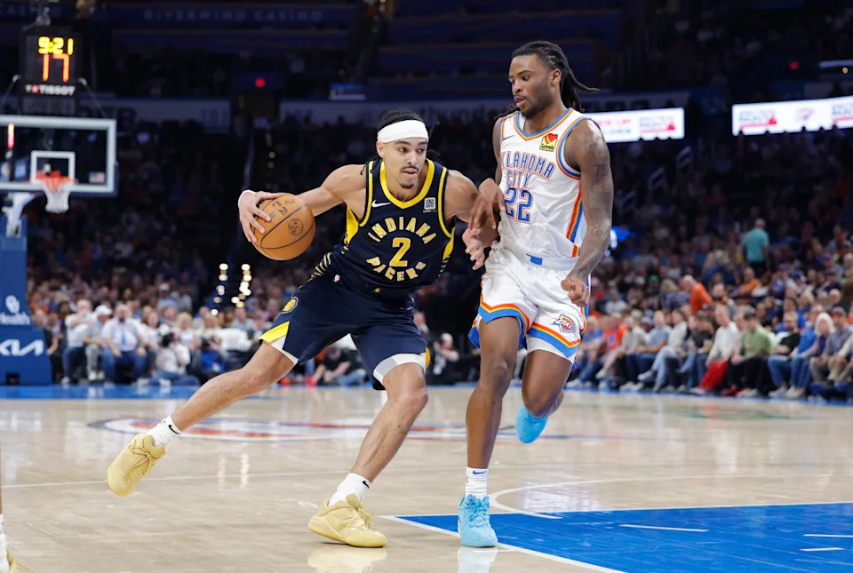Mar 29, 2025; Oklahoma City, Oklahoma, USA; Indiana Pacers guard Andrew Nembhard (2) drives down the court beside Oklahoma City Thunder guard Cason Wallace (22) during the second half at Paycom Center. © Alonzo Adams-Imagn Images
