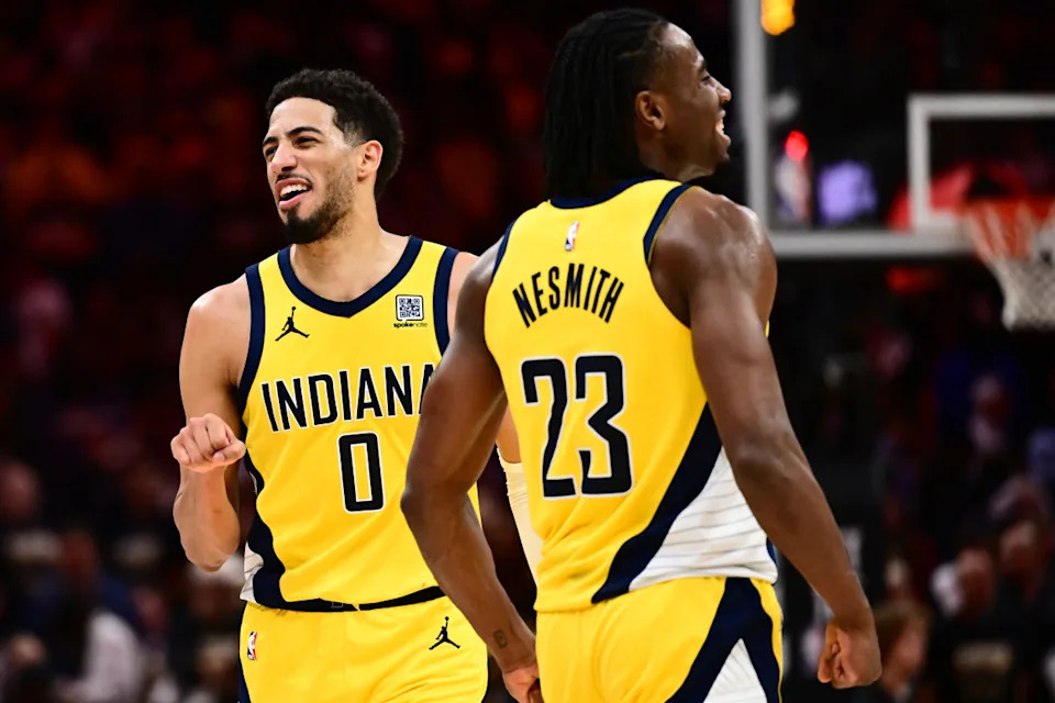 Indiana Pacers forward Aaron Nesmith (23) and guard Tyrese Haliburton (0) celebrate during a game.Ken Blaze-Imagn Images