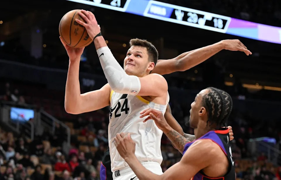 Mar 7, 2025; Toronto, Ontario, CAN; Utah Jazz center Walker Kessler (24) goes in for a layup over Toronto Raptors guard AJ Lawson (0) in the second half at Scotiabank Arena. Mandatory Credit: Dan Hamilton-Imagn ImagesMandatory Credit: Dan Hamilton-Imagn Images